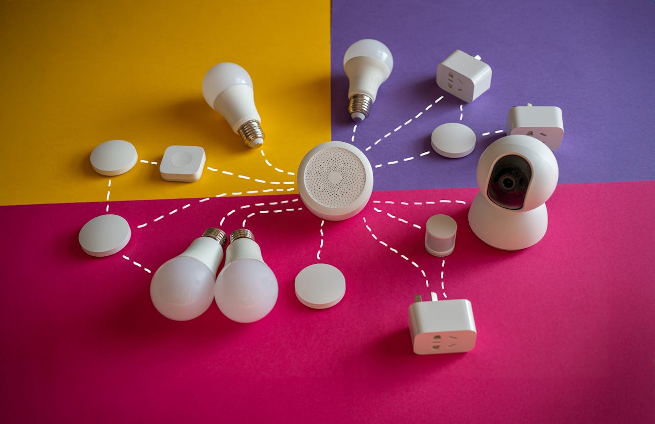 Home Smart home devices like bulbs and sockets connected on a vibrant backdrop.